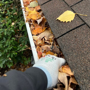 hand cleaning gutters
