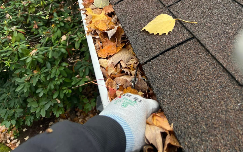hand cleaning gutters