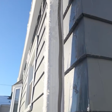 Split downspout seam caused by frozen water blockage during the January 2026 Ohio freeze.